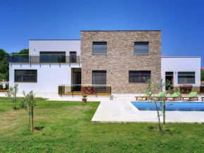 Modern villa consisting of two apartments with private pool beach at 1 km